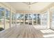 Bright sun room filled with windows offering panoramic views at 598 Summer Green Ct., Sunset Beach, NC 28468