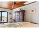 Cozy bedroom with wooden ceiling, king bed, view of nature, and stylish decor at 604 Ocean Boulevard W, Holden Beach, NC 28462