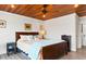 Bedroom features wood ceilings, a ceiling fan, and water views at 604 Ocean Boulevard W, Holden Beach, NC 28462