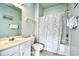 Bathroom featuring a single sink vanity, toilet and a shower with a patterned shower curtain at 6203 Catalina Dr. # 1811, North Myrtle Beach, SC 29582