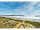 Picturesque beach access with wooden boardwalk leading to the sandy beach at 6203 Catalina Dr. # 1811, North Myrtle Beach, SC 29582