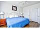 Inviting bedroom with hardwood floors, ceiling fan, a white frame bed and natural light at 6203 Catalina Dr. # 1811, North Myrtle Beach, SC 29582