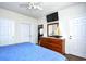 Well-lit bedroom with hardwood floors, ceiling fan, and ample closet space at 6203 Catalina Dr. # 1811, North Myrtle Beach, SC 29582