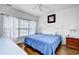 Comfortable bedroom featuring a large window, ceiling fan, and hardwood flooring at 6203 Catalina Dr. # 1811, North Myrtle Beach, SC 29582