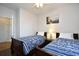 Inviting bedroom featuring two twin beds with blue patterned comforters and light walls at 6203 Catalina Dr. # 1811, North Myrtle Beach, SC 29582