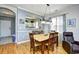 Cozy dining room with wood floors, stylish lighting, and comfortable seating by the living area at 6203 Catalina Dr. # 1811, North Myrtle Beach, SC 29582