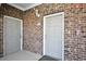 Brick wall with doors leading to individual units at 6203 Catalina Dr. # 1811, North Myrtle Beach, SC 29582