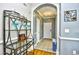 Hallway with tiled floors, gray walls, arched doorway and decorative display rack at 6203 Catalina Dr. # 1811, North Myrtle Beach, SC 29582