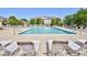 Inviting outdoor pool surrounded by lounge chairs and a beautifully landscaped residential complex at 6203 Catalina Dr. # 1811, North Myrtle Beach, SC 29582