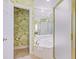 Bright bathroom featuring tiled floors, a soaking tub, separate shower, and a private toilet area at 63 Mckissick Dr. # 2B, Pawleys Island, SC 29585