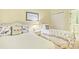 Shared bedroom with twin beds, nautical accents, and an attached bathroom at 63 Mckissick Dr. # 2B, Pawleys Island, SC 29585