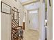 Inviting entryway with tile flooring, coat rack and neutral paint at 63 Mckissick Dr. # 2B, Pawleys Island, SC 29585