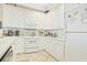 Bright kitchen featuring white cabinetry, and modern appliances at 63 Mckissick Dr. # 2B, Pawleys Island, SC 29585