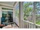 Relaxing screened porch offers views of lush greenery and a tranquil outdoor setting at 63 Mckissick Dr. # 2B, Pawleys Island, SC 29585