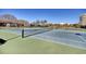 Outdoor tennis courts offer a great space for recreation with lush landscaping and nearby buildings at 63 Mckissick Dr. # 2B, Pawleys Island, SC 29585