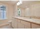 Bright bathroom with white cabinets, granite countertop, and window at 67 Bridgeview Rd., Georgetown, SC 29440