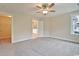 Well-lit bedroom with a glimpse into the bathroom, featuring clean lines and ample space at 67 Bridgeview Rd., Georgetown, SC 29440