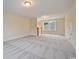 Large bonus room with plush carpet, natural light, and staircase access at 67 Bridgeview Rd., Georgetown, SC 29440