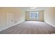 Expansive bonus room with carpeted floors, natural light, and closet at 67 Bridgeview Rd., Georgetown, SC 29440