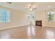 Spacious living room featuring a fireplace and large windows for ample natural light at 67 Bridgeview Rd., Georgetown, SC 29440