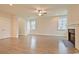 Open living room with a fireplace and large windows, perfect for Gathering gatherings at 67 Bridgeview Rd., Georgetown, SC 29440