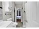 A clean and bright bathroom that opens to the bedroom, has storage cabinets at 699 Riverwalk Dr. # 202, Myrtle Beach, SC 29579