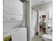 The well-lit bathroom features a combination washer/dryer, and a shower and tub combo at 699 Riverwalk Dr. # 202, Myrtle Beach, SC 29579