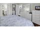 Comfortable bedroom featuring a dresser with mirror and access to the bathroom and kitchen at 699 Riverwalk Dr. # 202, Myrtle Beach, SC 29579