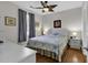 Well-lit bedroom features stylish ceiling fan, hardwood floors, and coastal-themed decor at 699 Riverwalk Dr. # 202, Myrtle Beach, SC 29579