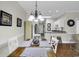 Dining area adjacent to kitchen, featuring a stylish table and chairs, with views to the kitchen at 699 Riverwalk Dr. # 202, Myrtle Beach, SC 29579