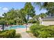 Outdoor community pool surrounded by lush landscaping at 699 Riverwalk Dr. # 202, Myrtle Beach, SC 29579
