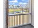 Balcony view overlooking a beautiful golf course and pond on a sunny day at 699 Riverwalk Dr. # 202, Myrtle Beach, SC 29579