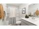 This stylish bathroom features a shower-tub combo with bright, neutral finishes at 7071 Shooting Star Way, Myrtle Beach, SC 29579