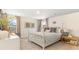 Serene bedroom boasts natural light, a cozy bed, and elegant decor and furnishings at 7071 Shooting Star Way, Myrtle Beach, SC 29579