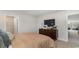 Neutral bedroom with a cozy bed, dresser, and a chalkboard against the wall at 7071 Shooting Star Way, Myrtle Beach, SC 29579