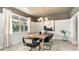 Elegant dining room with modern chandelier, large window, and stylish decor at 7071 Shooting Star Way, Myrtle Beach, SC 29579
