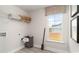 Well-lit laundry area with ample storage, a practical layout and backyard view at 7071 Shooting Star Way, Myrtle Beach, SC 29579