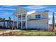 Beautiful two-story home with double porches, two car garage, and landscaped front yard at 7079 Shooting Star Way, Myrtle Beach, SC 29579