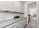 Spacious pantry with granite countertops and ample storage, offering convenience and organization at 7079 Shooting Star Way, Myrtle Beach, SC 29579