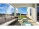 Relaxing screened porch features neutral furnishings and views of the surrounding landscape at 7079 Shooting Star Way, Myrtle Beach, SC 29579