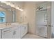 Bathroom featuring double vanity sinks, cabinets, and large mirror at 82 Bridgeview Rd., Georgetown, SC 29440