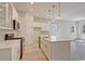 Well-lit kitchen with white cabinets, a center island, and stainless steel appliances at 82 Bridgeview Rd., Georgetown, SC 29440