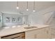 Modern kitchen island with stainless steel appliances and pendant lighting in an open-concept living space at 82 Bridgeview Rd., Georgetown, SC 29440