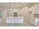Bright kitchen featuring white cabinets, quartz countertops, and pendant lighting at 82 Bridgeview Rd., Georgetown, SC 29440