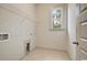 Laundry room with natural light and tile flooring at 82 Bridgeview Rd., Georgetown, SC 29440