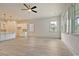 View of the living area into the kitchen, featuring gray tile flooring and recessed lighting at 82 Bridgeview Rd., Georgetown, SC 29440