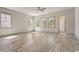 Bright living room featuring ample natural light and stylish gray wood-look flooring at 82 Bridgeview Rd., Georgetown, SC 29440