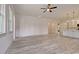 Open-concept living area featuring light gray tile flooring, recessed lights, and adjacent kitchen at 82 Bridgeview Rd., Georgetown, SC 29440
