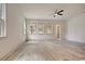 Spacious living room featuring recessed lighting, a ceiling fan, and large windows at 82 Bridgeview Rd., Georgetown, SC 29440