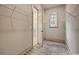 Walk-in closet with built-in shelving and doorway view to ensuite bathroom at 82 Bridgeview Rd., Georgetown, SC 29440